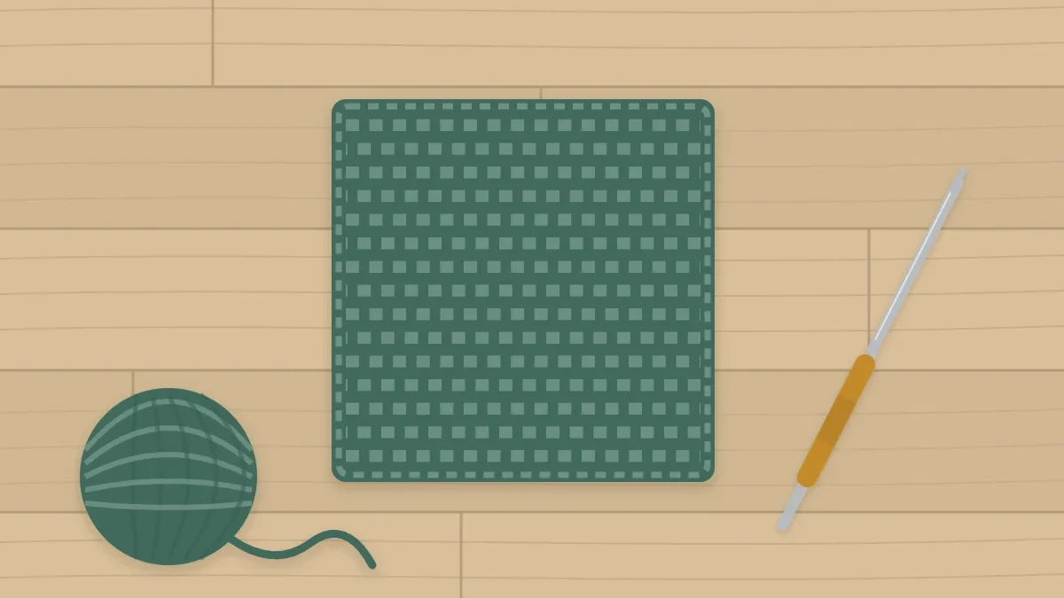 A simple square single-crochet coaster in sage with a hook and a small ball of yarn