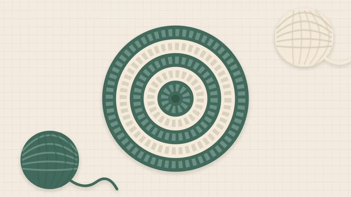 A striped round coaster in sage and cream with one yarn ball of each color