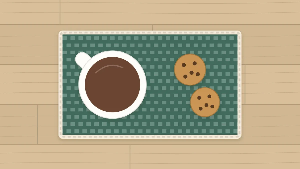 A rectangular mug rug with a mug on one side and two cookies on the other
