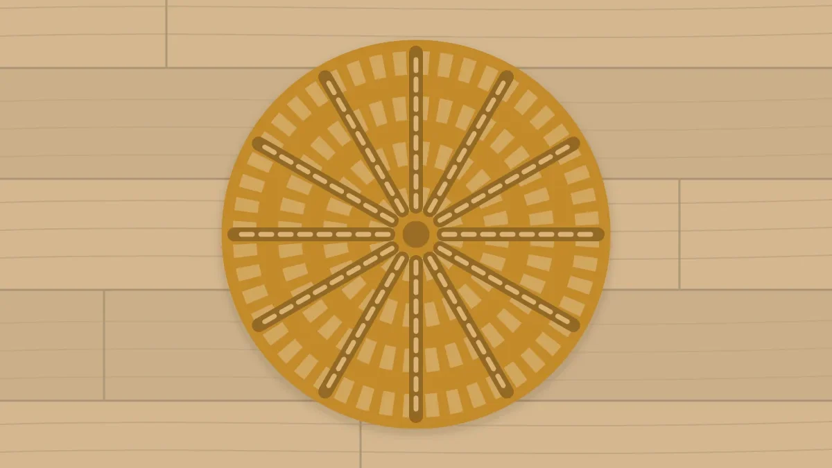 A round coaster in honey with raised ridges radiating from the center like spokes